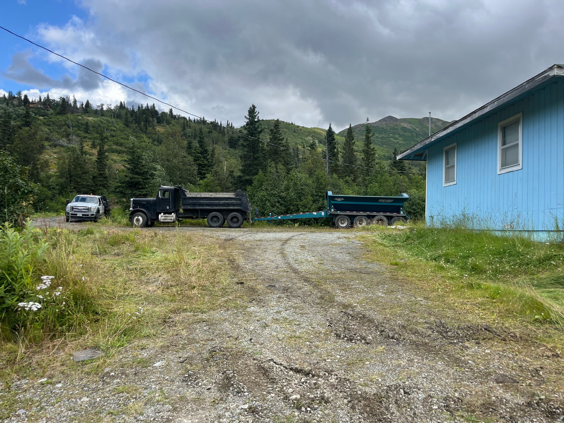 Fleet of trucks at the yard with mountains