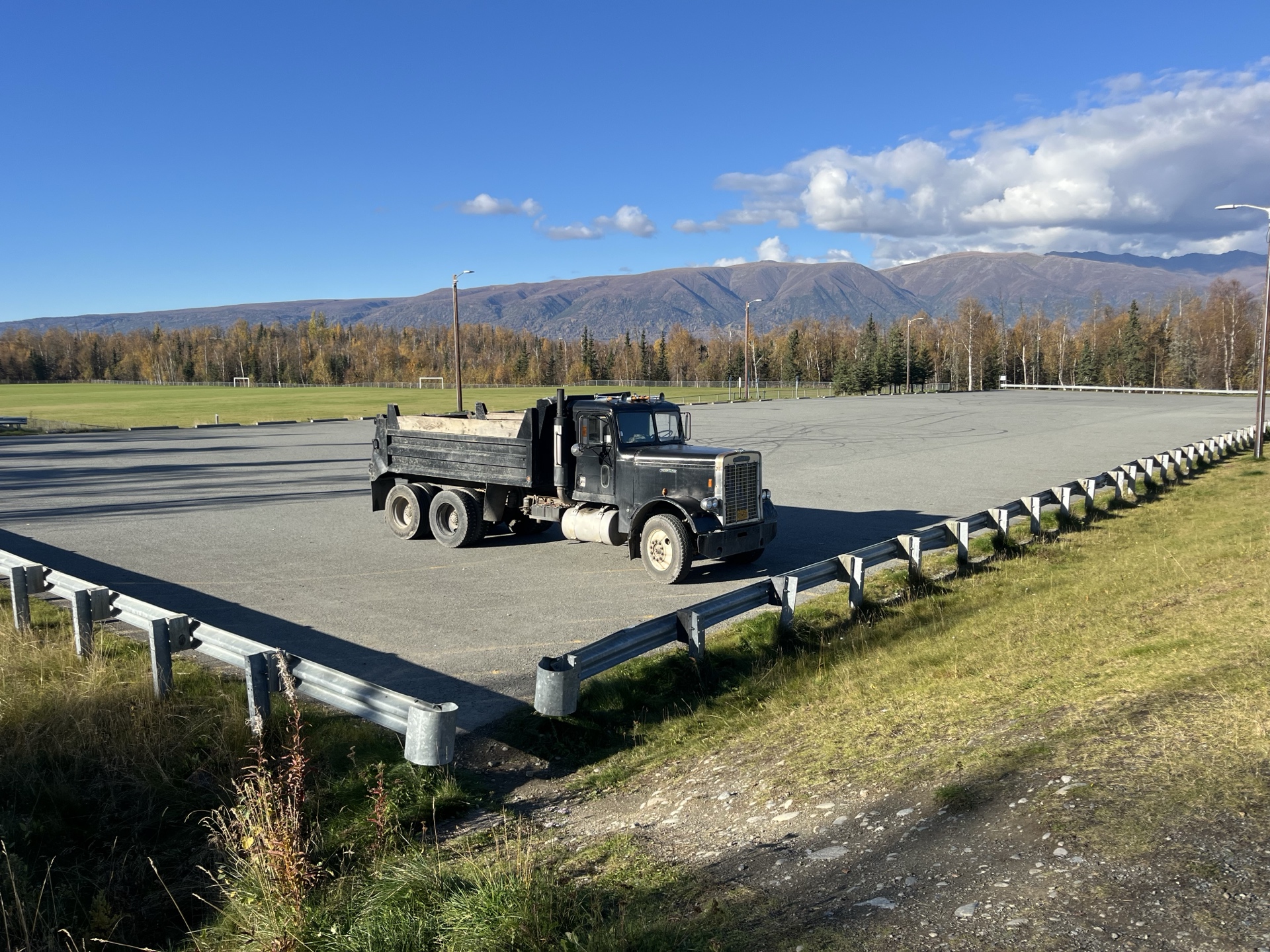 Dump truck in fall with mountains